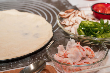 Preparing seafood homemade pizza. close up.