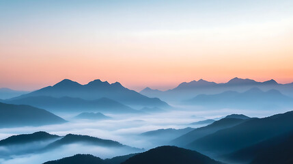 Obraz premium Foggy mountain range at dawn, mist covering the valleys, soft pastel colors in the sky