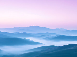 Fototapeta premium Quiet misty hills at twilight, soft purple and blue tones in the fog