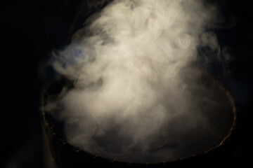 Blurred picture of white smoke from cooking in countryside kitchen for abstract background and dark tone. soft picture