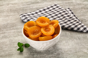 Sweet canned apricots with syrope