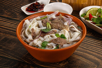 Vietnamese Pho Bo soup with beef and noodles