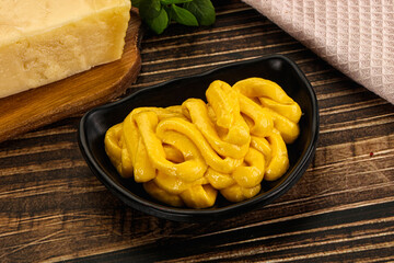 Yellow cheese sauce in the bowl