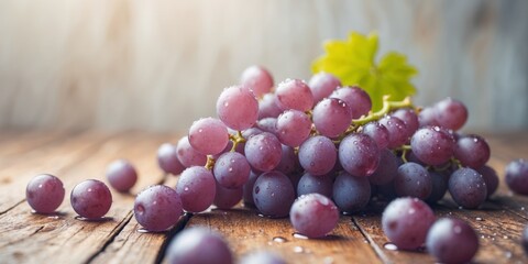 Fresh grapes with droplets on a wooden surface