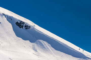 Hiking up the ridge of a cornice