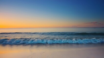 Obraz premium the sun is setting over the water on the beach