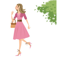 木漏れ日とお洒落な洋服を着て出かける女性