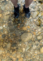 Exploring Nature: Trekking Through River with Boots in Colombia