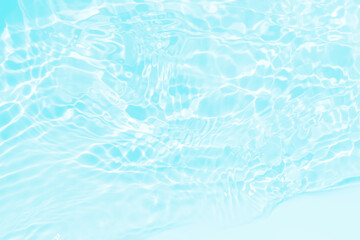 Blue water with ripples on the surface. Defocus blurred transparent blue colored clear calm water...