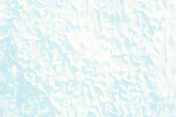 Blue water with ripples on the surface. Defocus blurred transparent blue colored clear calm water surface texture with splashes and bubbles. Water waves with shining pattern texture background.