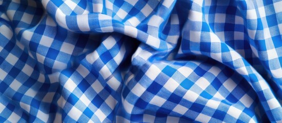 Blue and white checkered fabric texture with folds and creases, ideal for fabric design and background usage, Copy Space