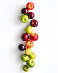 Apples and green apples falling through the air, isolated on a white background, viewed from above. 