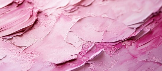 Textured abstract paint background in shades of pink with copy space for text. Macro close-up of acrylic paint layers.
