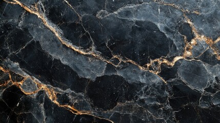 Elegant black marble surface with striking grey and gold veining texture ideal for luxury design and decor projects.