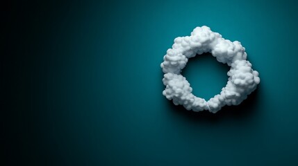 Cloud Circle on Teal: A single white cloud, shaped like a circle, floats against a solid teal backdrop. The image evokes a sense of simplicity and tranquility, suggesting a clear and open sky.