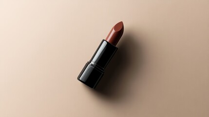 Elegant Brown Lipstick on Beige Background: A Makeup Product Shot