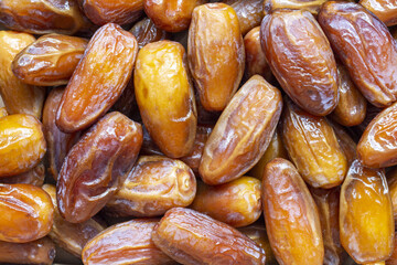 Dates fruit close up background. Top view of dried dates fruits.