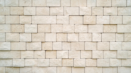 Naklejka premium close up of flat brick wall background showcasing light colored stone blocks arranged in neat pattern, creating textured and visually appealing surface