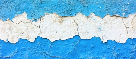 Obraz premium Peeling blue and white paint on weathered wall surface with cracked texture and Copy Space for text placement