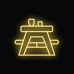 Yellow neon sign showing a picnic table with a wine glass and bottle on a black background