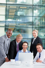 Fototapeta premium Portrait, investor and business people on laptop with lawyers for court case research and planning. Confident, smile or proud director with attorney, advisor or meeting at law firm for legal team
