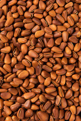 close up of roasted pine nuts background 