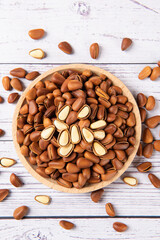 roasted pine nuts food on wooden table.