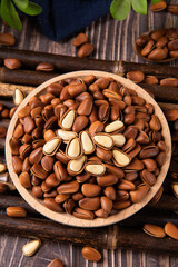 roasted pine nuts food on wooden table.