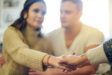 Fototapeta premium Therapy, counseling and therapist holding hands for couple session, consulting and relationship advice. Psychology, marriage help and woman with clients for support, empathy and professional care