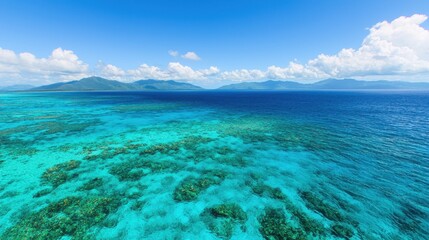 Clear Blue Ocean with Coral Reef and Island View