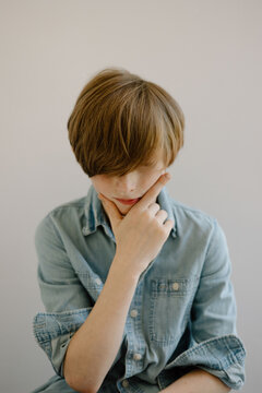 Young boy with contemplative facial expression