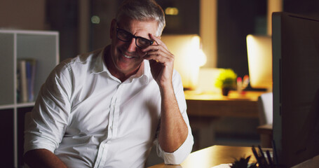 Night, happy and mature man in office, entrepreneur and laughing for success of business and...
