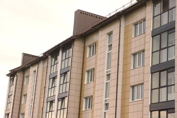 Fototapeta premium Tiled facade of a new apartment building