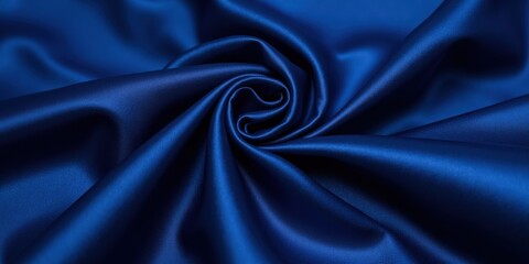 Obraz premium Rich royal blue satin with a lustrous sheen; intricate folds create captivating depth and dimension. A luxurious embrace of color and texture