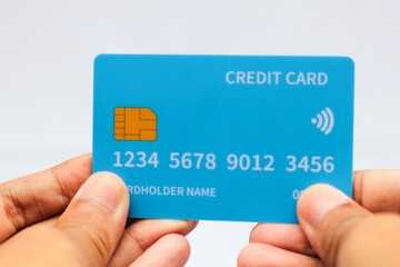 Hand holding credit card isolated on white background,business concept