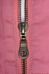 Pink jeans zipper. Close-up of women's jeans, jeans with zipper.