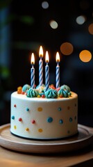 Birthday Cake with Four Candles Lit