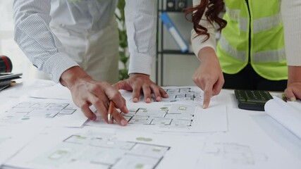 Close up of hands working brainstorming and measuring for cost estimating on paperworks and floor plan drawings about design architectural and engineering for houses and buildings. - Powered by Adobe