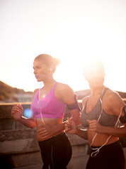 Friends, women and running with music outdoor for cardio workout, endurance challenge and listening to radio. Mockup, flare or people with teamwork for fitness jog, sport training or healthy exercise