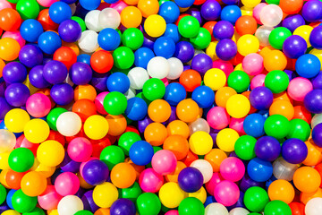 A cheerful ball pit filled with bright and colorful plastic balls.