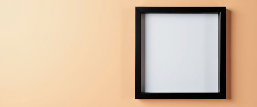 Sleek Black Frame Against Soft Peach Background: Modern Contrast and m Ambiance