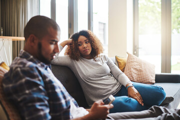 Couple, separation or fight with argument on sofa for disagreement, conflict or living room dispute...