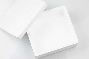 Styrofoam is a synthetic material made up of small air-filled particles that is lightweight and has excellent heat insulating properties.