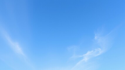 Serene Blue Sky with Wispy Clouds - Natural Background