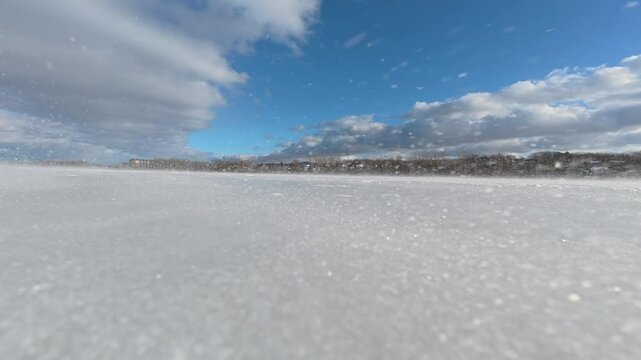 Cyclist on a frozen lake in Canada