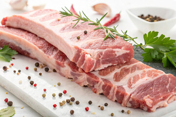 Fototapeta premium Large pieces of fresh pork on a white background