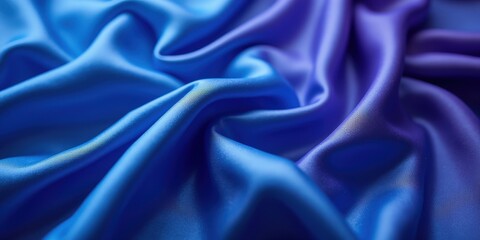 Obraz premium Velvety blue and purple satin fabric reveals smooth, shimmering layers—a rich dark blue atop a soft, lighter hue. A luxurious tapestry dance of color and texture