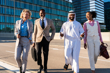 Group of multiethnic business people meeting an emirati businessman - International corporate...