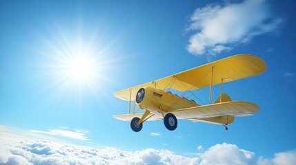 Yellow biplane flying above clouds in sunny sky.