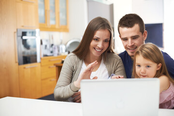 Family, child and wave for laptop for video call, talking or online communication in home. Kid, dad or mom with hello greeting on technology for virtual conversation, connection or bonding together